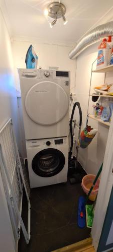 a washer and dryer in a small room at Paul's House in Saltstraumen