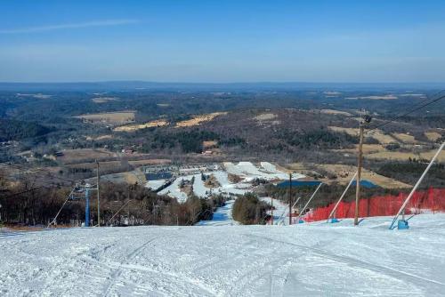 a ski slope with snow on the side of a mountain at WOW!! Ultimate Pocono Retreat, Hot Tub, Game Room, Deck, Lakes, Skiing, Pools in Long Pond