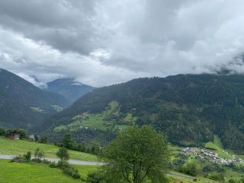 a view of a valley with a town and mountains at Apart Zangerle in Fliess