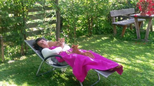 a little girl laying in a lawn chair with her stuffed animals at FP Muehlmann&Schoen in Innervillgraten