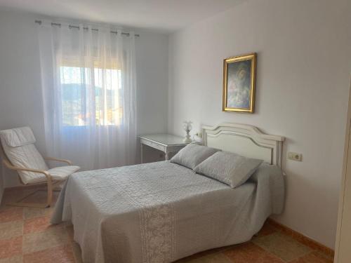 A bed or beds in a room at El Mirador de Sierra Mágina entre Granada y Jaén