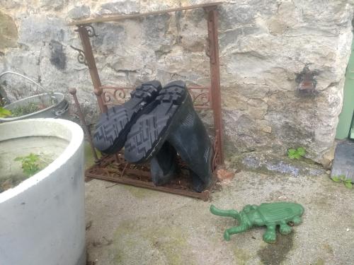 a pile of bags and a toy turtle on the ground at La grange aux dîmes in Walcourt