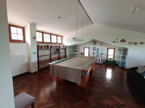 a large room with a table in the middle of it at Villino Sabina in Civitella del Tronto