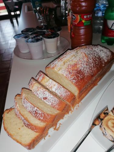 a white plate with slices of bread on a table at Il Castello in Castel di Sangro