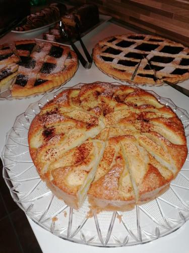 three pizzas sitting on a glass plate on a table at Il Castello in Castel di Sangro