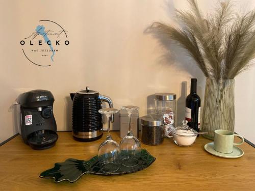a counter with a coffee maker and other items on it at Apartament Olecko Nad Jeziorem in Olecko