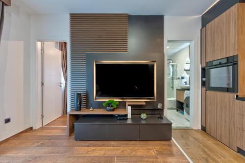 a living room with a large flat screen tv at Apartman Riva in Vrnjačka Banja