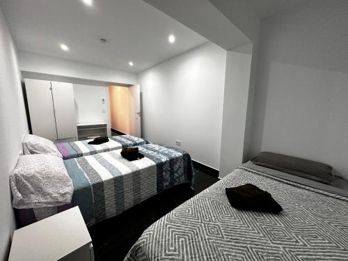 Postel nebo postele na pokoji v ubytování CASTELLON DELUXE