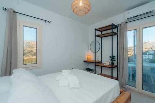 Ένα ή περισσότερα κρεβάτια σε δωμάτιο στο Loukoum House