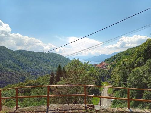 a view of a valley with a road and mountains at Ca' di Aroha in Musignano