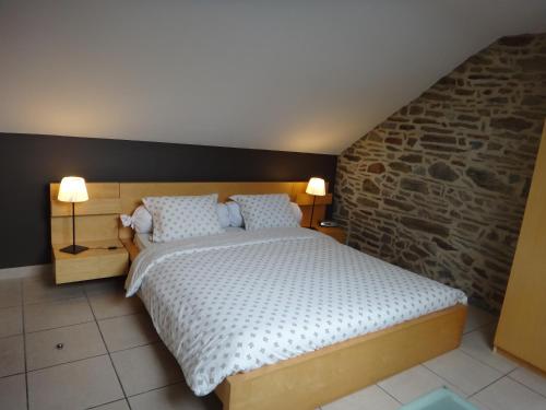 Llit o llits en una habitació de Holiday home Gîte rural Côté Fagnes