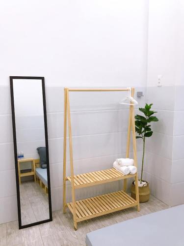 a room with a swing and a mirror at B Home in Can Tho