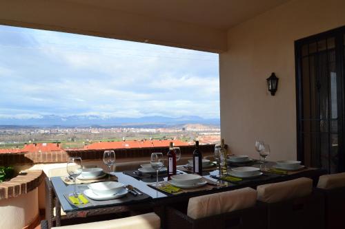 a dining table with a view of the city at LA PRENSA in Villamediana de Iregua