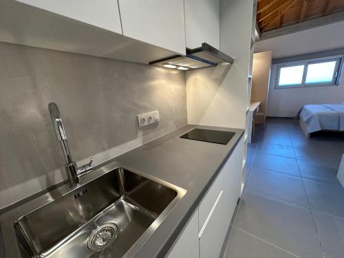 a kitchen with a sink and a counter top at Pasithea Suites in Monemvasia