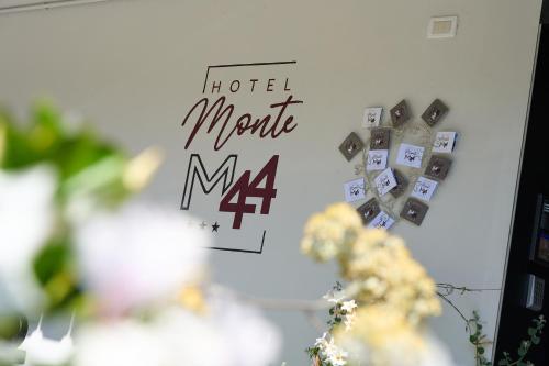 a sign that says hotel mama on a wall at Hotel Monte44 in Selva di Val Gardena