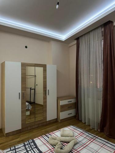 a bedroom with a large mirror and a bed at DONA PALACE GOLD 2 in Tbilisi City