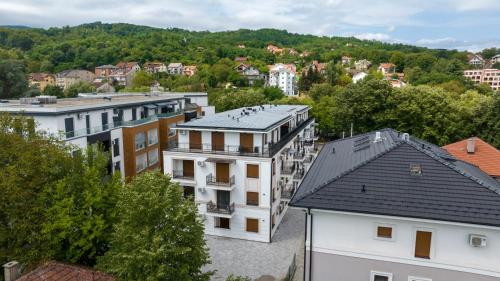 an aerial view of a city with buildings at Contigo Apartman Vrnjacka Banja - Vrnjacka promenada in Vrnjačka Banja
