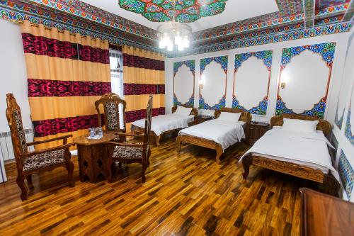 Кровать или кровати в номере Khiva Silk Road
