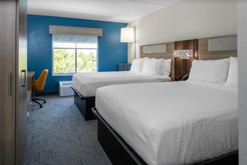 a hotel room with two beds and a window at Holiday Inn Express - Rocky Mount - Sports Center by IHG in Rocky Mount