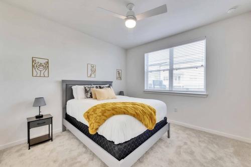 a white bedroom with a large bed and a window at Charming 1 BR Austin Oasis-Perfect for your vacation! in Kyle