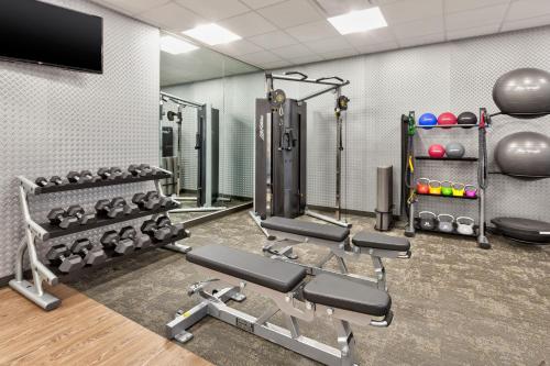 a fitness room with a gym with weights at Fairfield by Marriott Inn & Suites Grand Rapids North in Walker