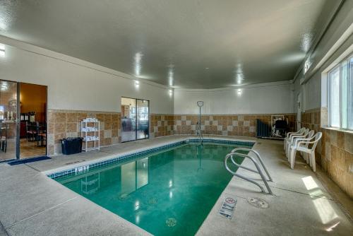 a large swimming pool in a house with at Super 8 by Wyndham Alamosa in Alamosa