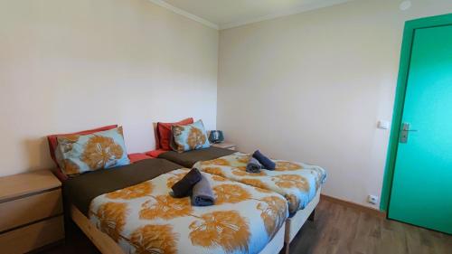 a bedroom with two beds in a room at Bonjoia Apartments in Porto