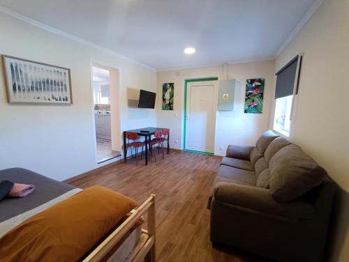 a living room with a couch and a table at Bonjoia Apartments in Porto