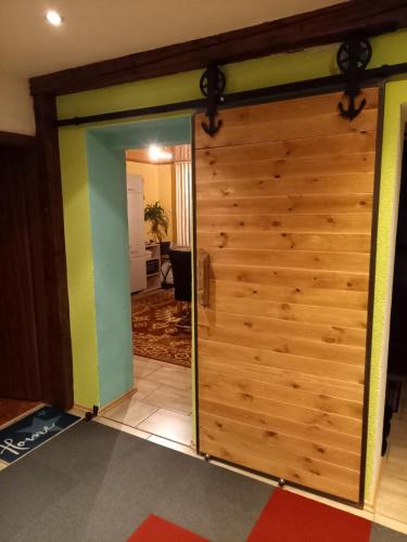 a sliding door leading into a living room at Monteur- und Ferienwohnung Waldrauschen in Fehrenbach