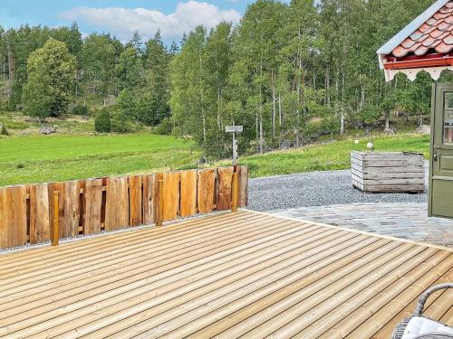 a wooden deck with a fence in a yard at 4 star holiday home in Mellösa-By Traum in Mellösa