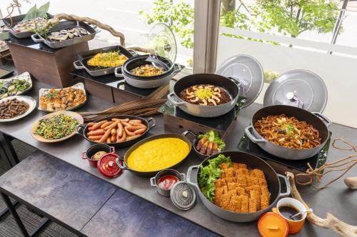 a table topped with lots of different types of food at Okayama Washington Hotel Plaza in Okayama