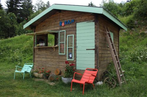 a small house with two chairs and a ladder at Domaine de Rozan - Col de Porte, Chartreuse - Grenoble in Sarcenas