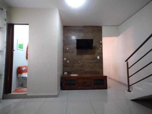 Televisyen dan/atau pusat hiburan di Pousada dos Sonhos Interlagos