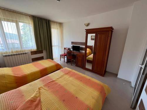 Letto o letti in una camera di Centaur Family Hotel