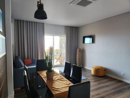 a dining room with a table and chairs at Rosegarden View in Velas