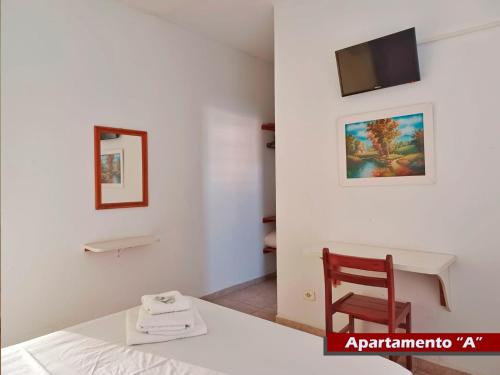 TV a/nebo společenská místnost v ubytování Rial Hotel