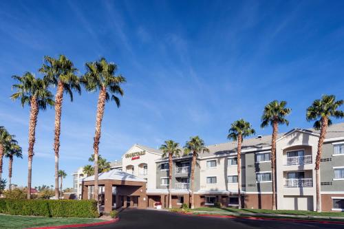 a row of palm trees in front of a building at Courtyard by Marriott Henderson - Green Valley - Las Vegas in Las Vegas