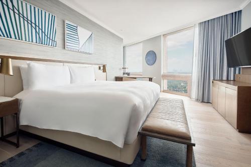 a hotel room with a large bed and a television at JW Marriott Hotel Mexico City Polanco in Mexico City