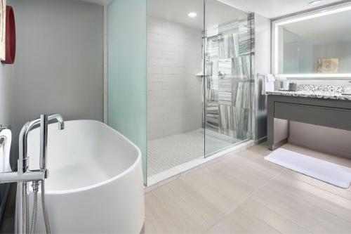 a white bathroom with a tub and a shower at JW Marriott Hotel Mexico City Polanco in Mexico City