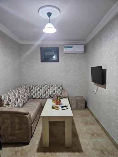 a living room with a couch and a table at Galstyans Home EVN Airport in Yerevan