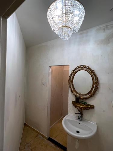 a bathroom with a sink and a mirror at Catherine's house in Veľký Krtíš