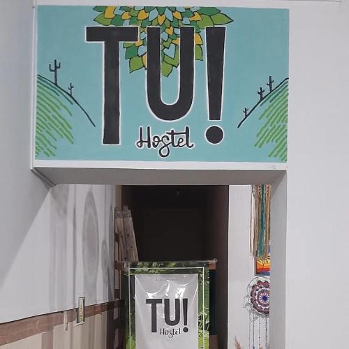 a sign for a tuc hospital in a store at Tu Hostel Tucuman in San Miguel de Tucumán