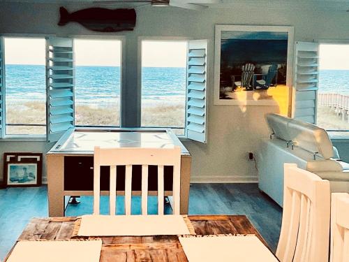 a living room with a view of the ocean at Auberge d'Amelia in Fernandina Beach