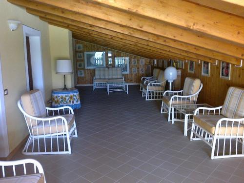 a living room with chairs and a table at Country House Salomè in Musile di Piave