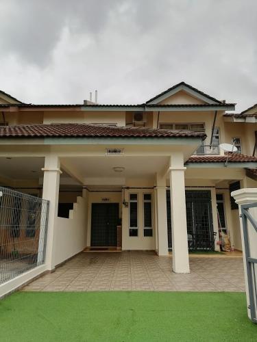 a house with a large driveway in front of it at DKAMAR Homestay At Desaru, Fully Aircond, WiFi, Coway, Street View 4 min to Desaru Beach in Kangkar Chemaran