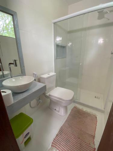 a bathroom with a toilet and a sink and a shower at Greenhouse in Sana