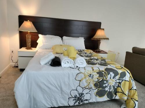 a bedroom with a bed with a teddy bear on it at Gorgeous ,stylish and Beautiful Luxury Apartment with stuning Downtown View.Featuring American and French style in Frederick