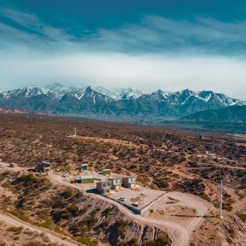 an aerial view of the desert with mountains in the background at Reflejo del Lago - Cabañas frente al Dique Potrerillos in Ciudad Lujan de Cuyo