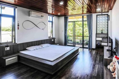 Ένα ή περισσότερα κρεβάτια σε δωμάτιο στο F.Home Modern & Art 3BR Near My Khe Beach
