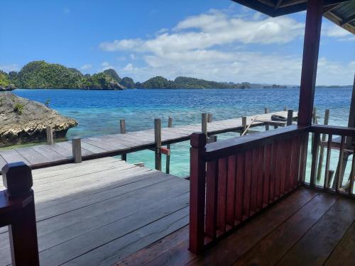 a view of the ocean from a porch of a house at Nuttonton Homes in Papas